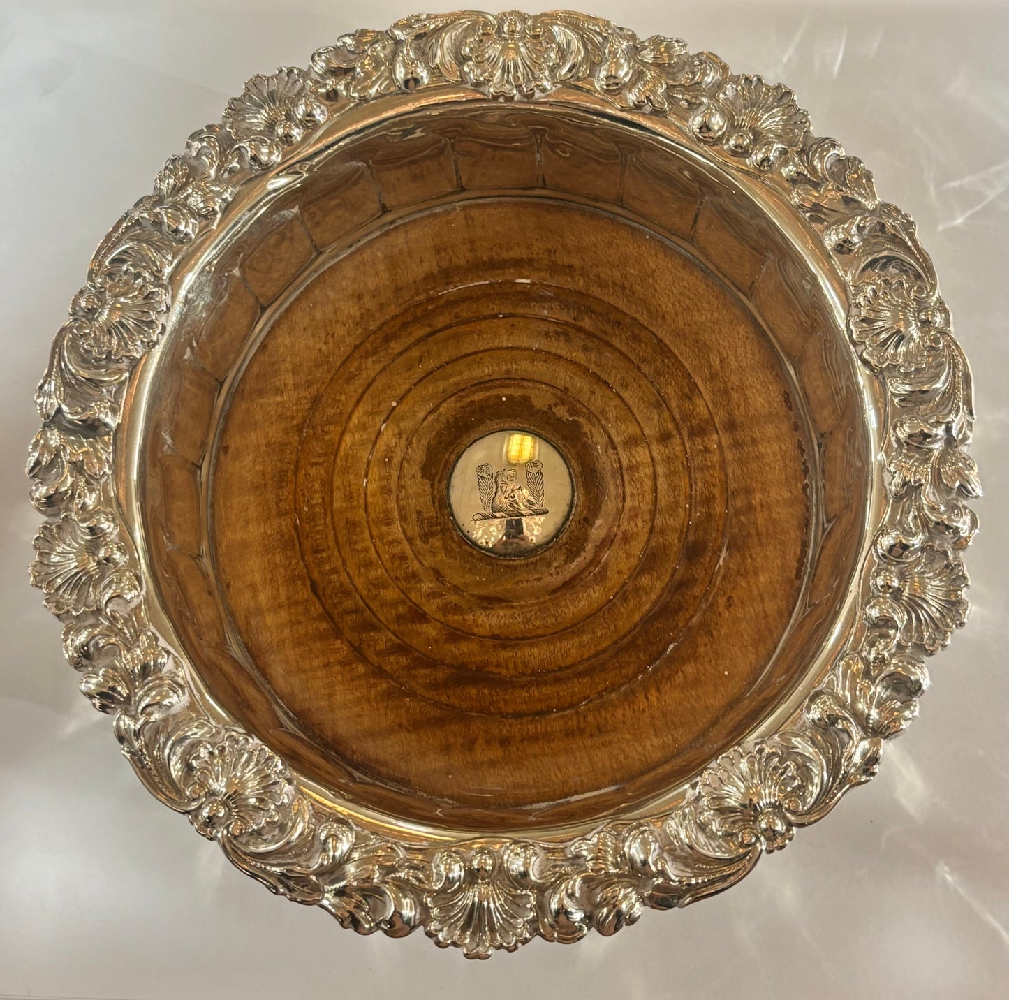 pair of Georgian silver-mounted oak wine bottle coasters