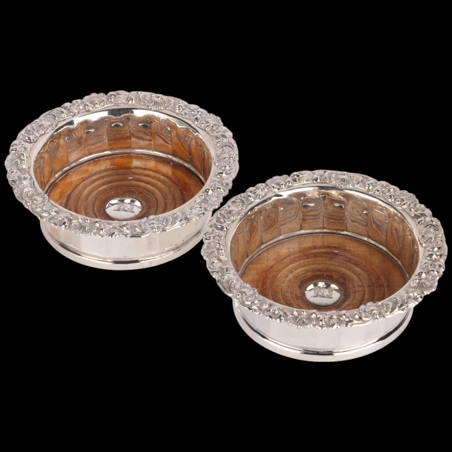 pair of Georgian silver-mounted oak wine bottle coasters