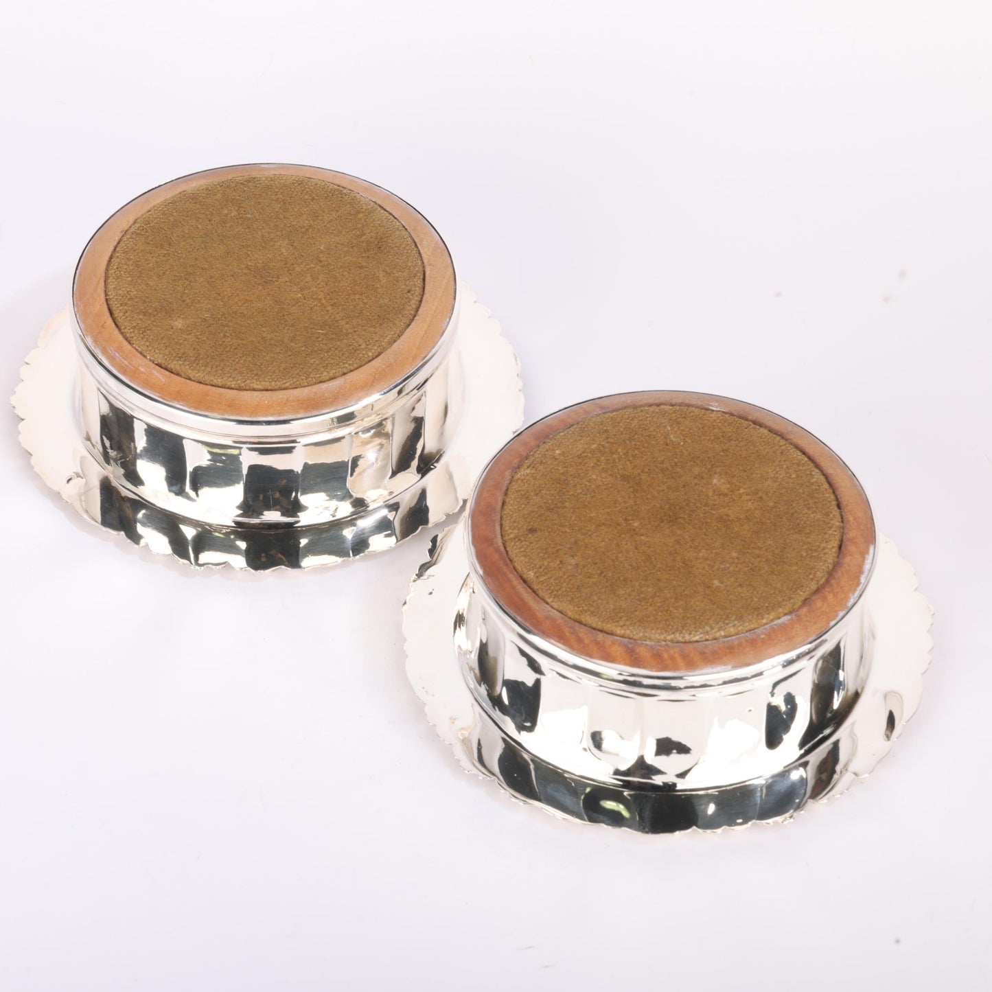 pair of Georgian silver-mounted oak wine bottle coasters